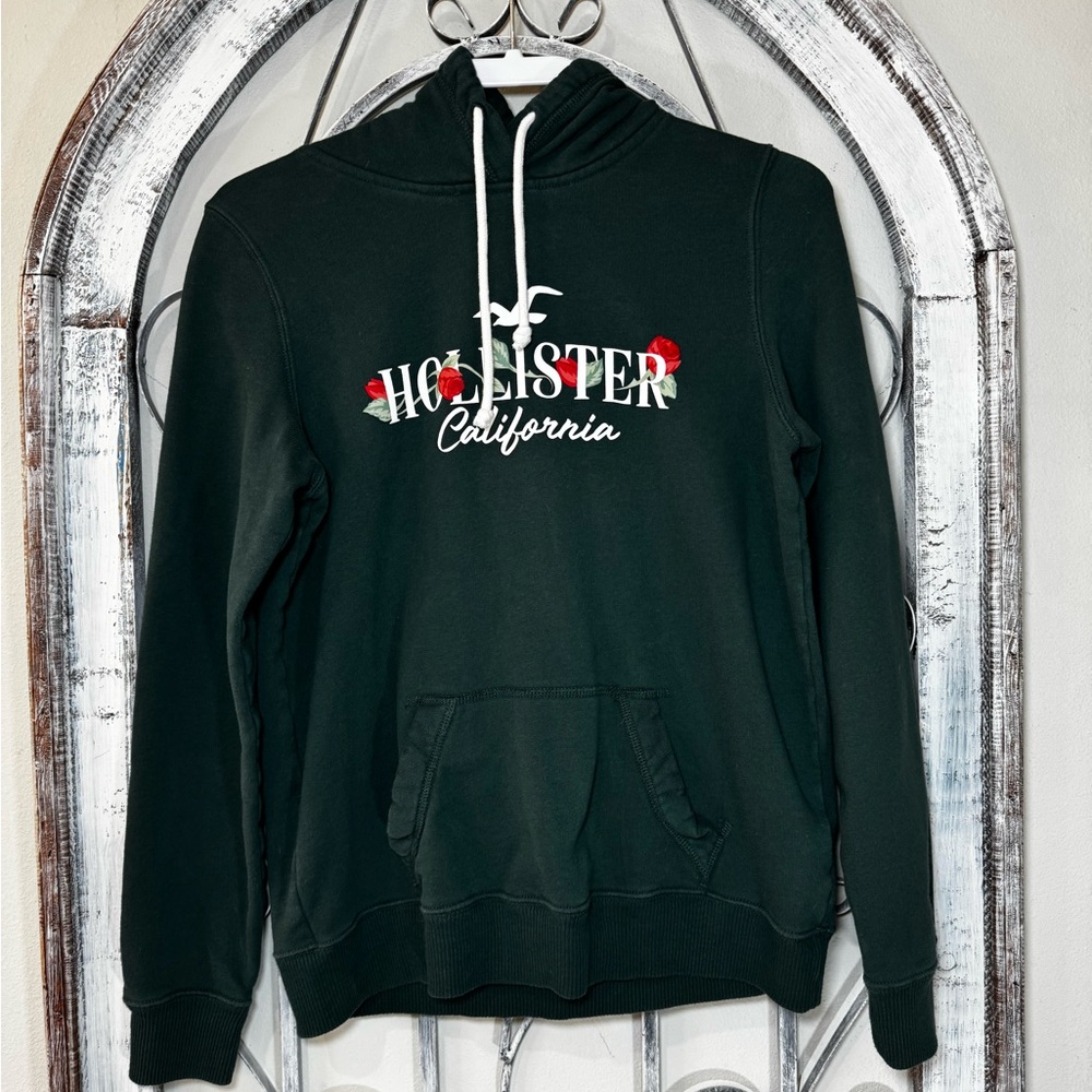 Hollister Men's Dark Green Hoodie with Red Floral Accents #1586